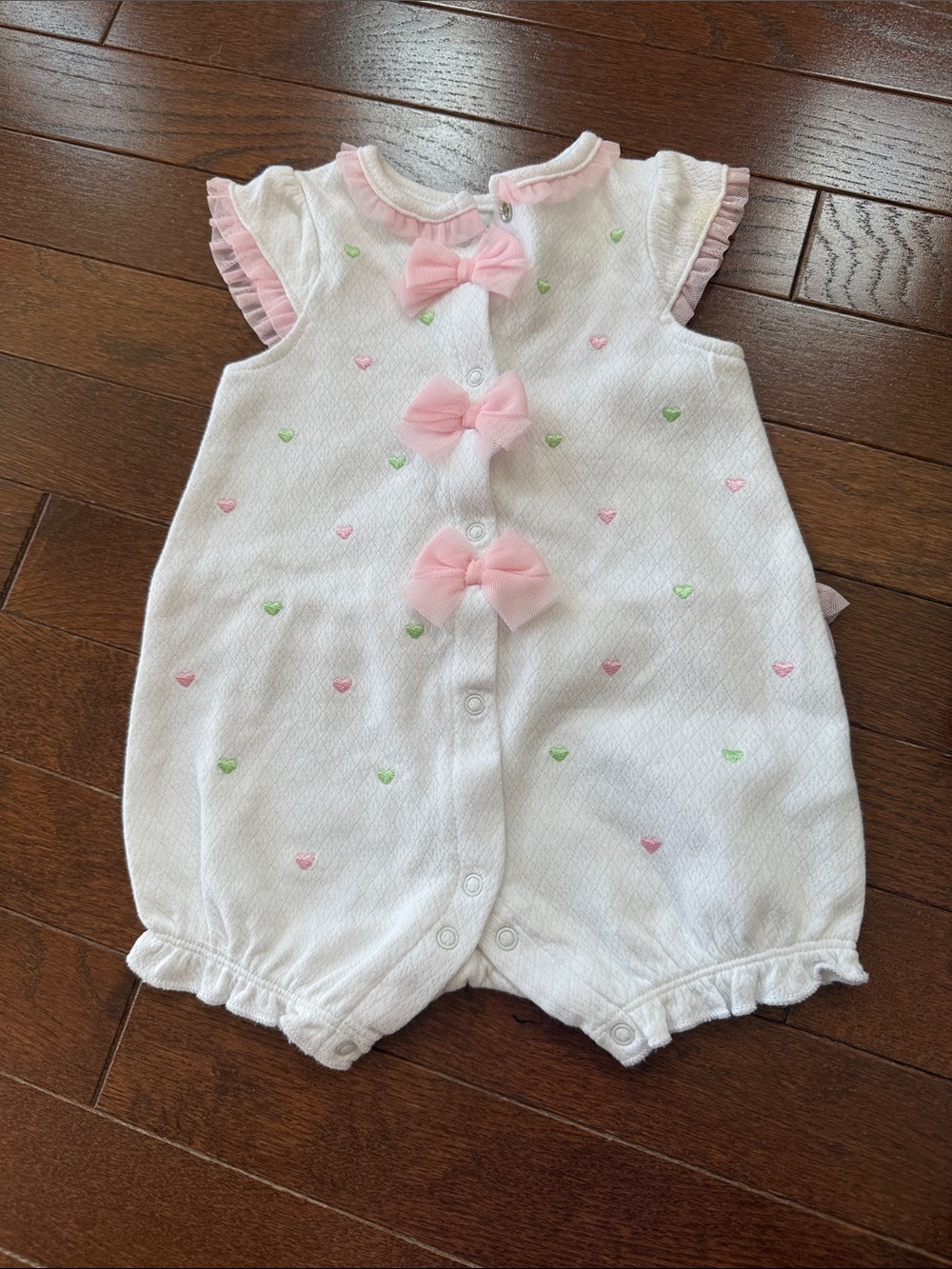 Little Me White Romper with Pink Bows and Green Heart Accents